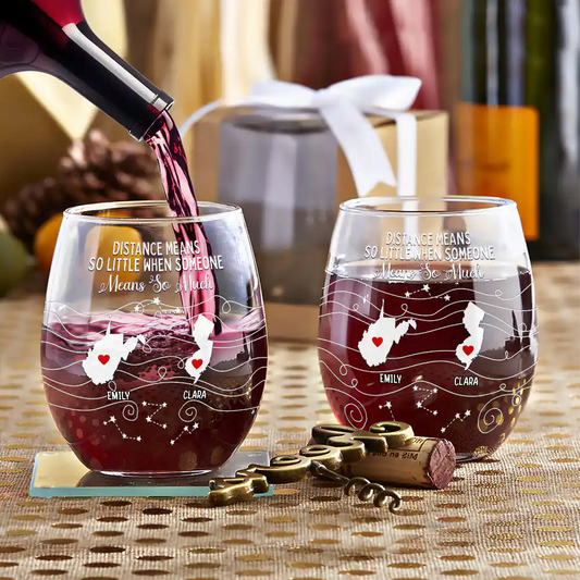 Personalized stemless wine glasses with state maps, being filled with red wine. Gift for family, friends.